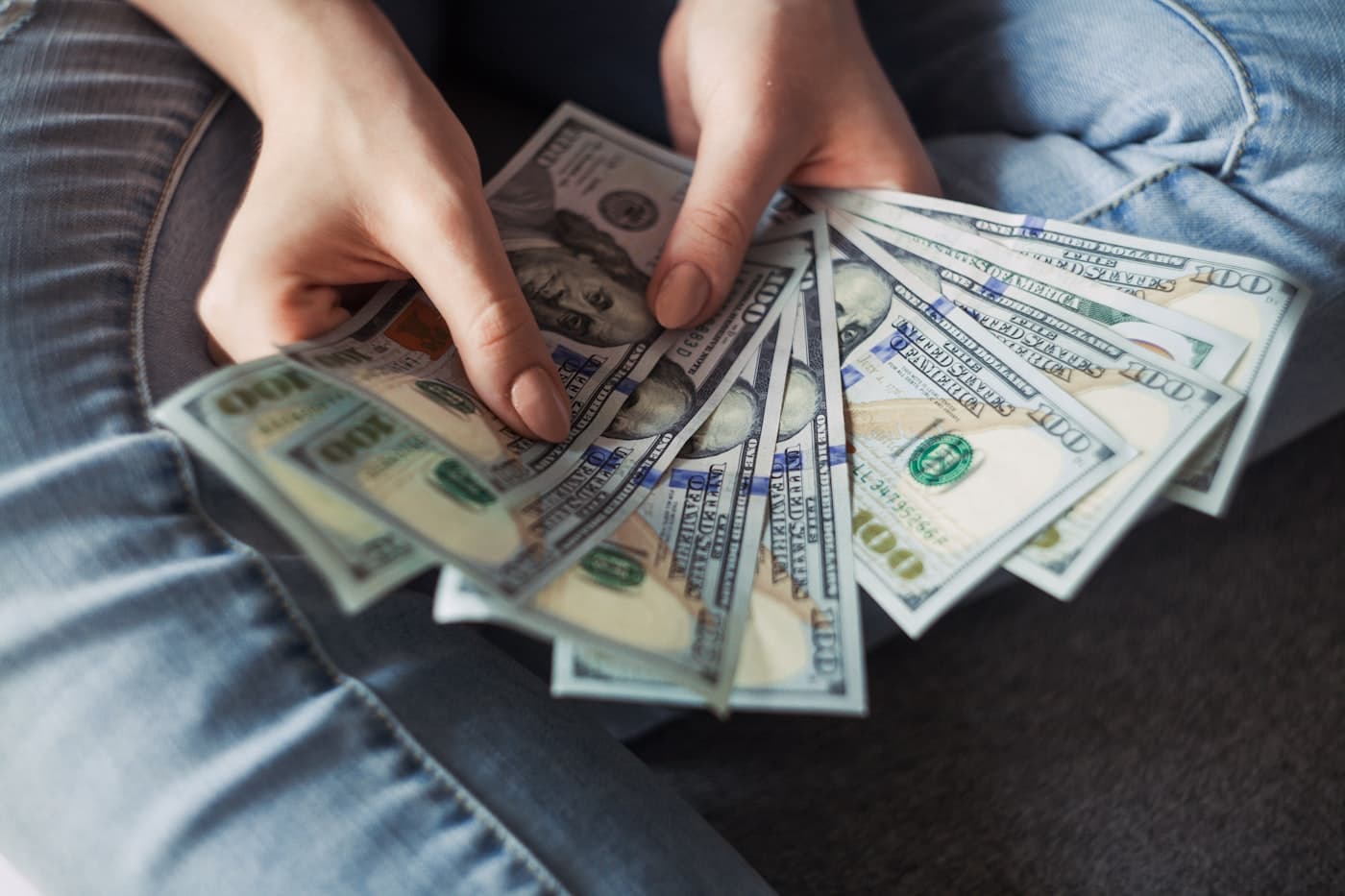 Hands reviewing financial documents and digital tools